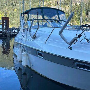 Professional marine ceramic coating creating water beading effect on boat surface